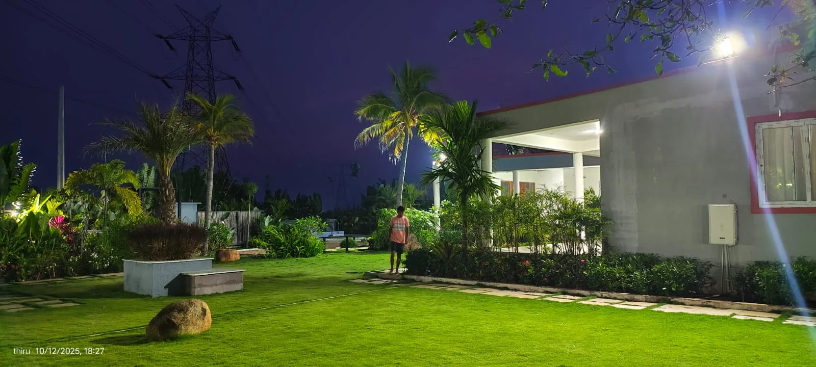 Amara Haven lawn illuminated at night