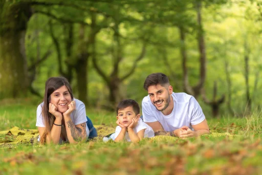 A family relaxing together in a green park