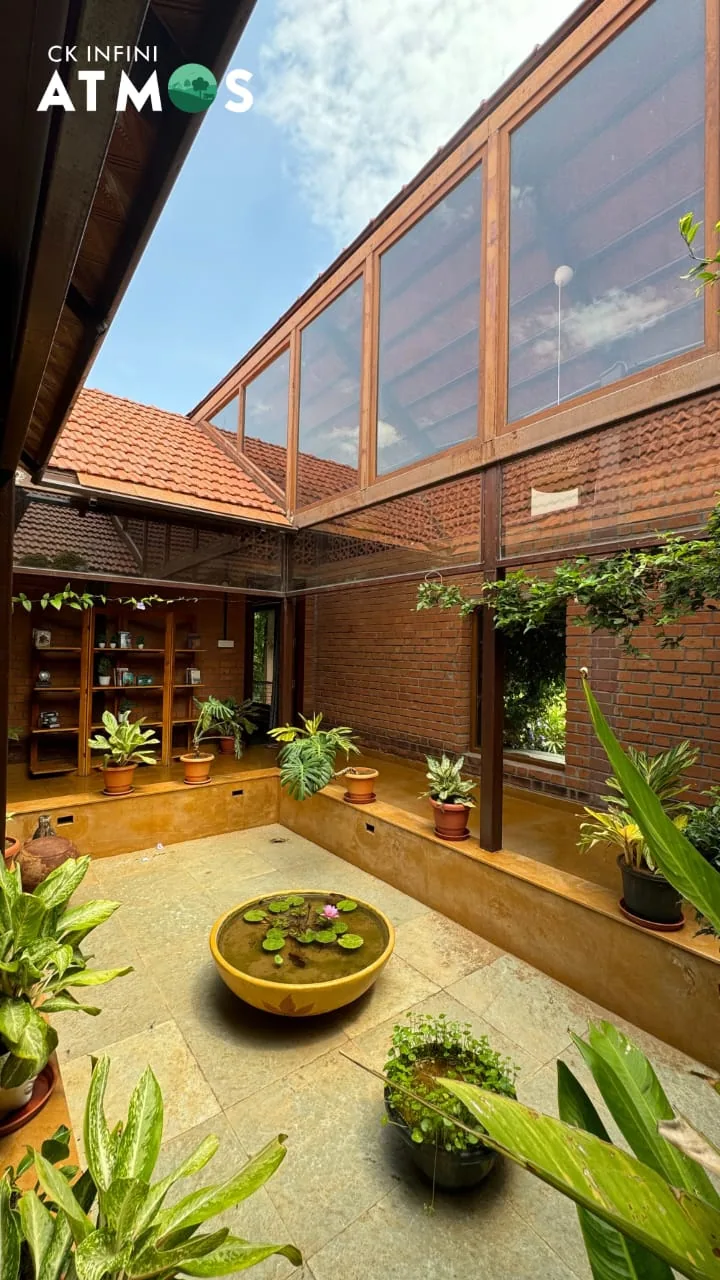 Double-height brick courtyard at CoQuitos