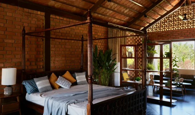 CK Infini Hospitality warm bedroom interior with natural materials