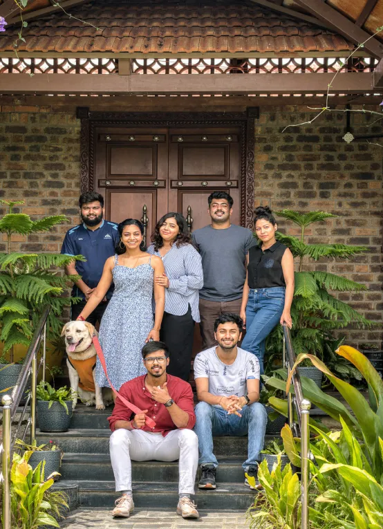CK Infini customers standing outside a stone residence