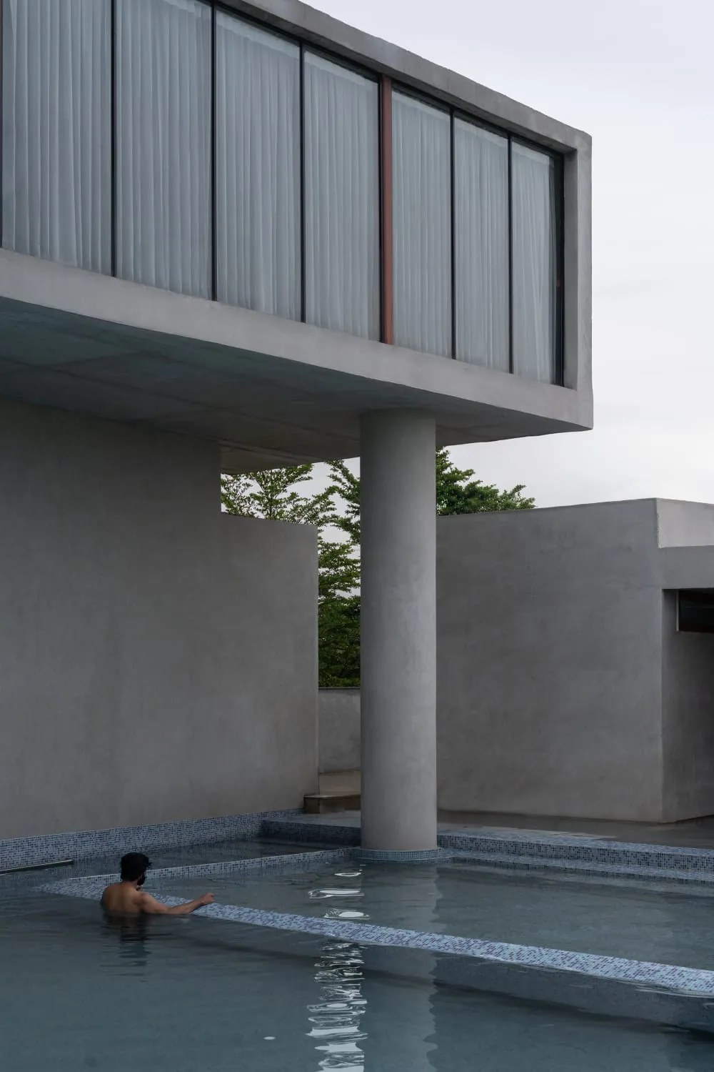 Cantilevered glass room above the pool