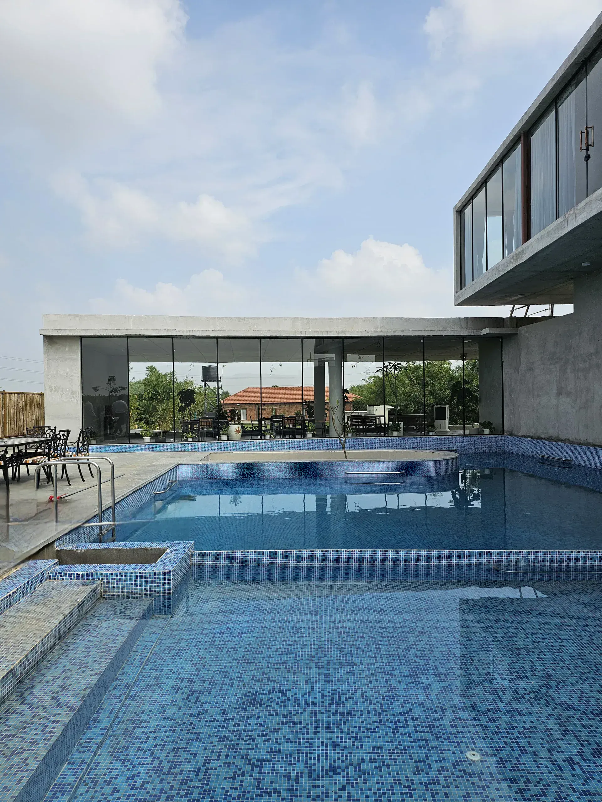R.House pool and glass-walled dining pavilion